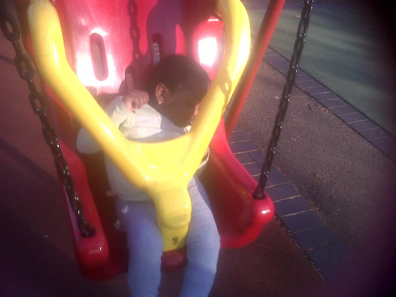Abigail enjoying an outdoor play ride.