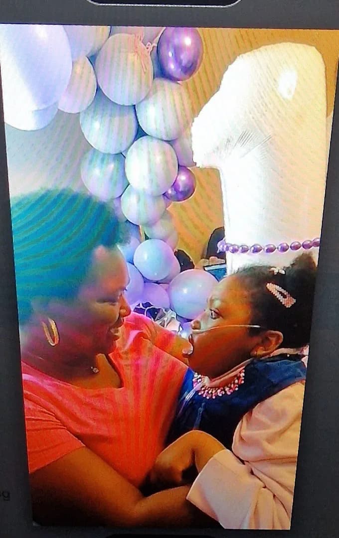 Abigail sharing a close moment with family.