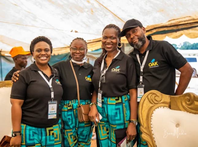 Four OAKonsult Nigeria team members at an event