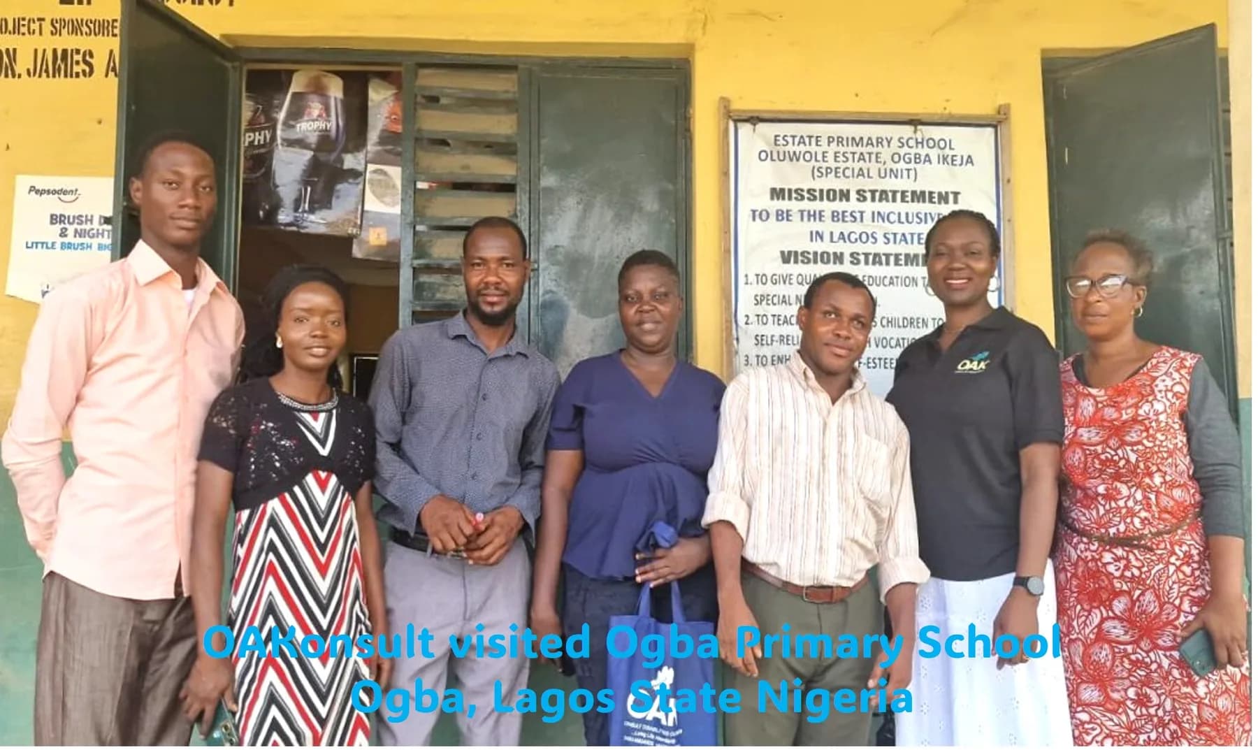OAKonsult representatives with staff during a school visit in Lagos
