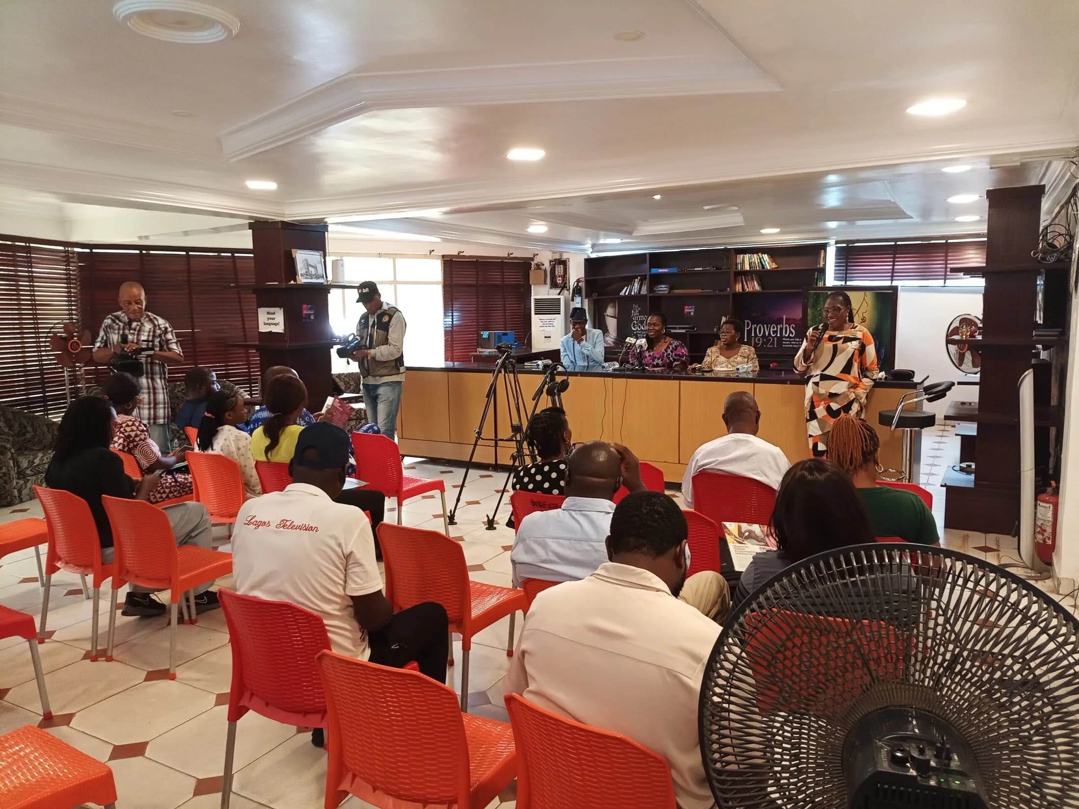 Speakers and guests gathered in a press-conference room