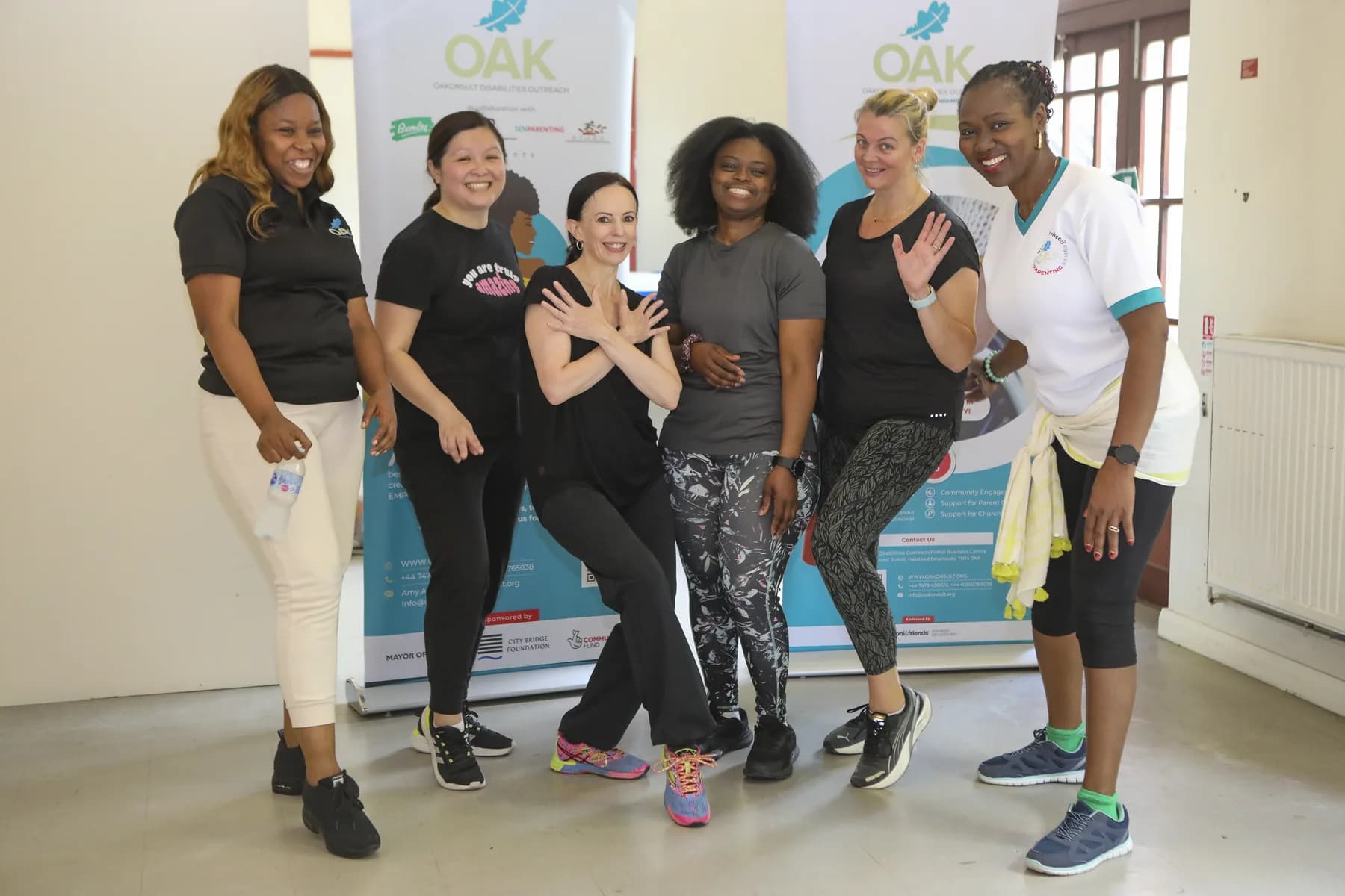Six women smiling together after an OAKonsult Zumba class