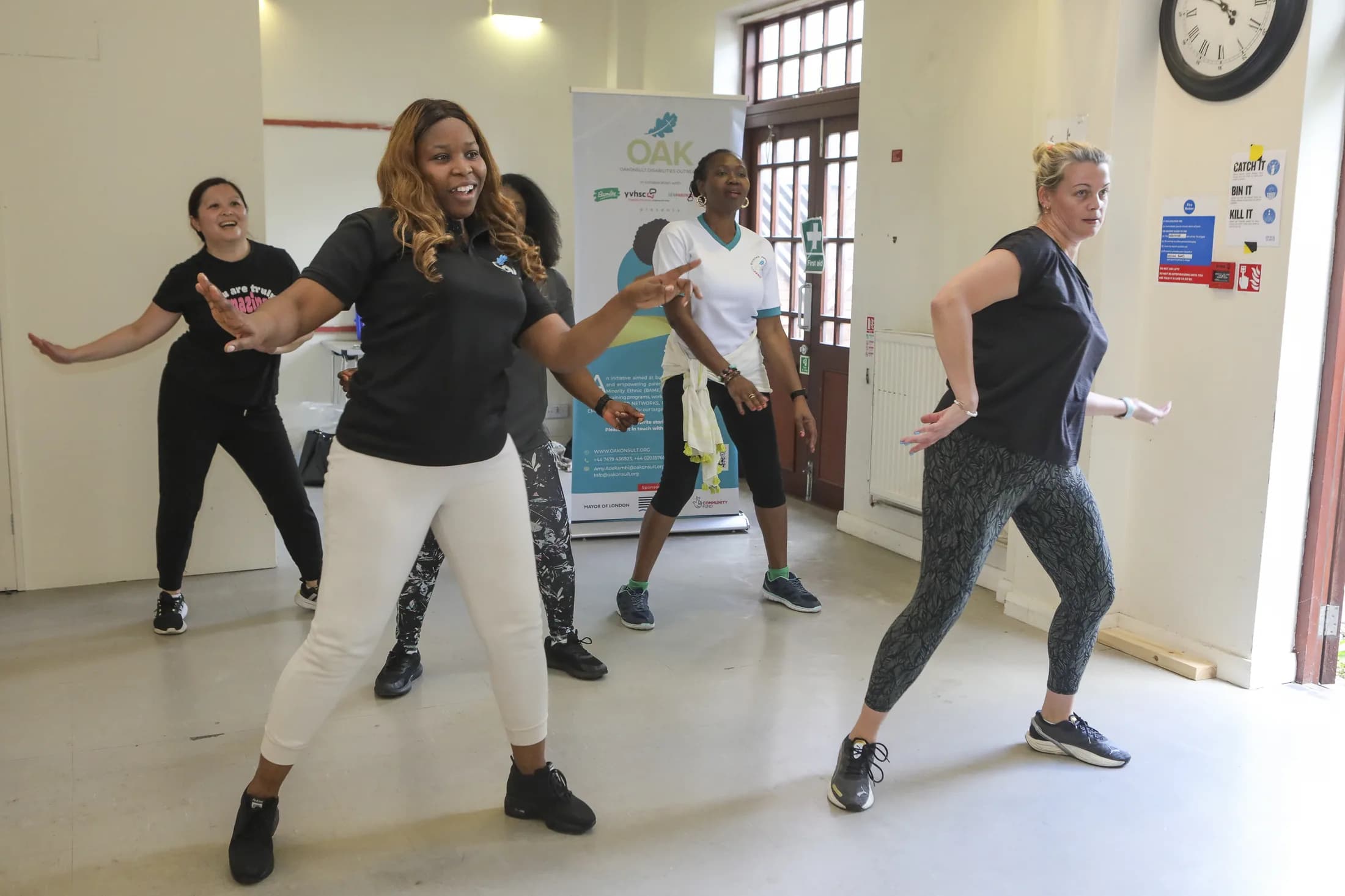 Parent carers moving together during an OAKonsult Zumba class