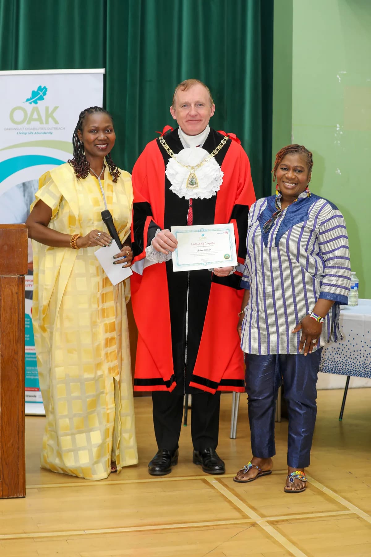 A Project ME participant receiving a certificate on stage