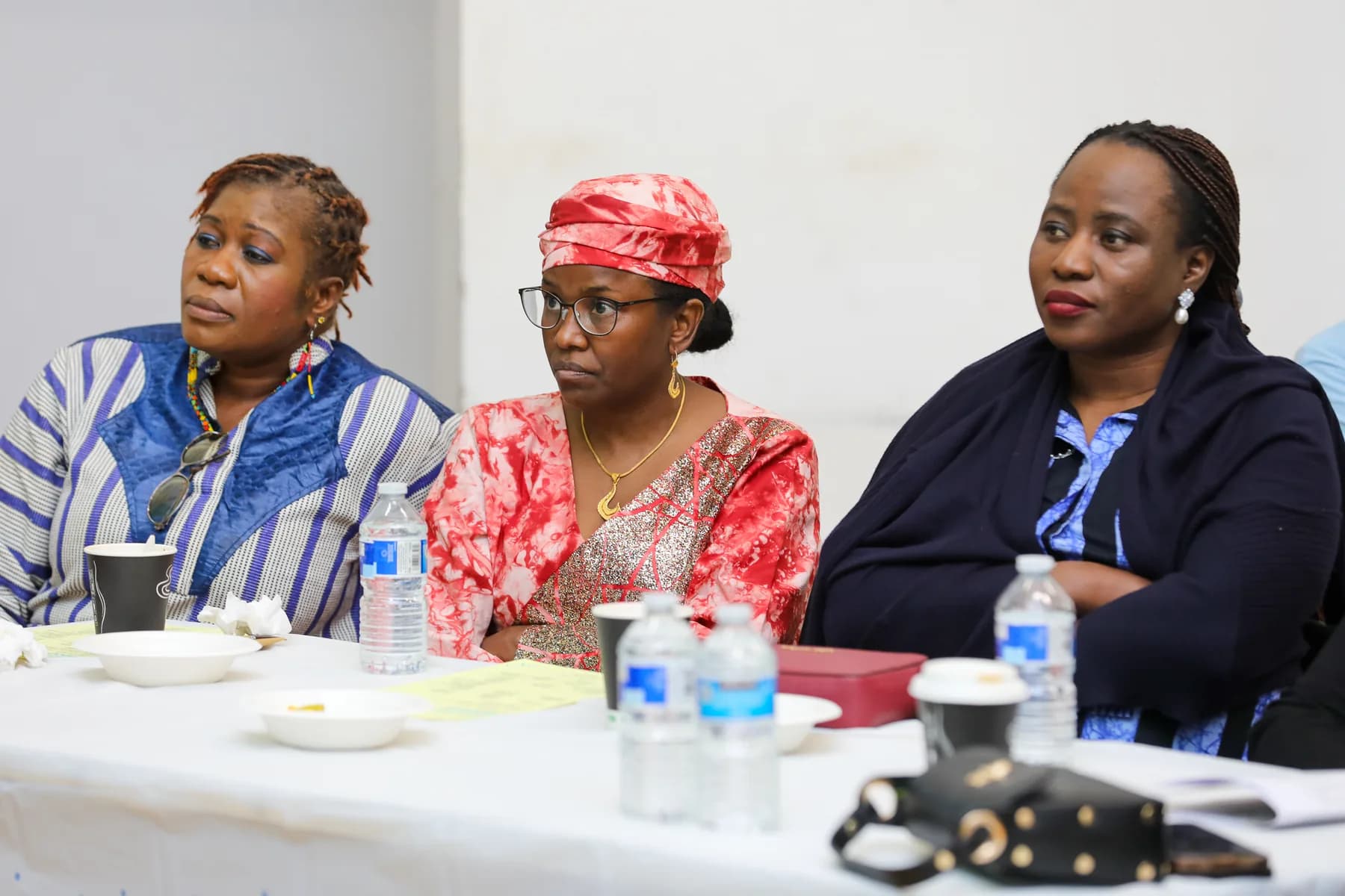 Three Project ME guests seated together during the programme event