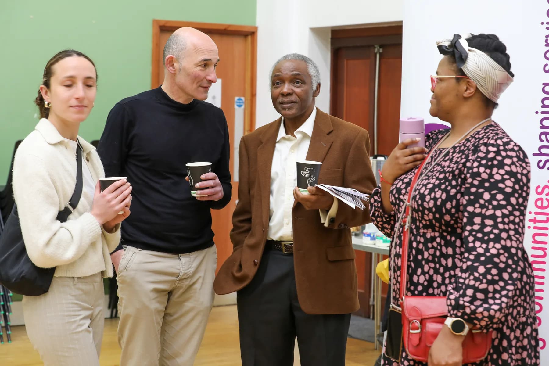 Four guests talking together at an OAKonsult event