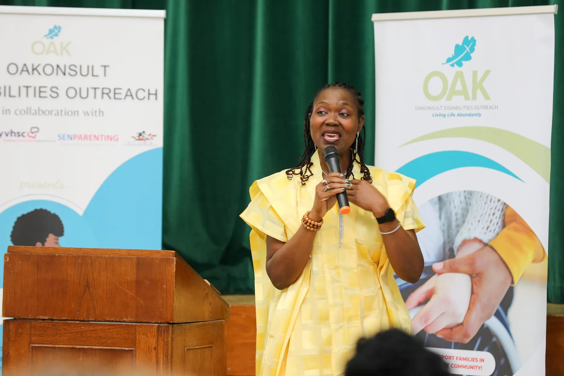 An OAKonsult representative speaking at the Project ME celebration