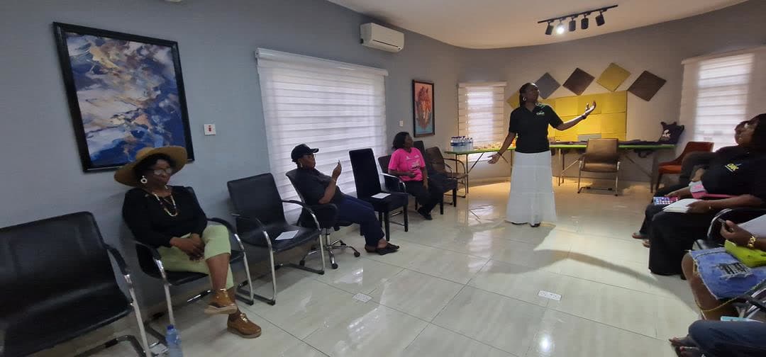 Adults taking part in a facilitated OAKonsult community session in Nigeria